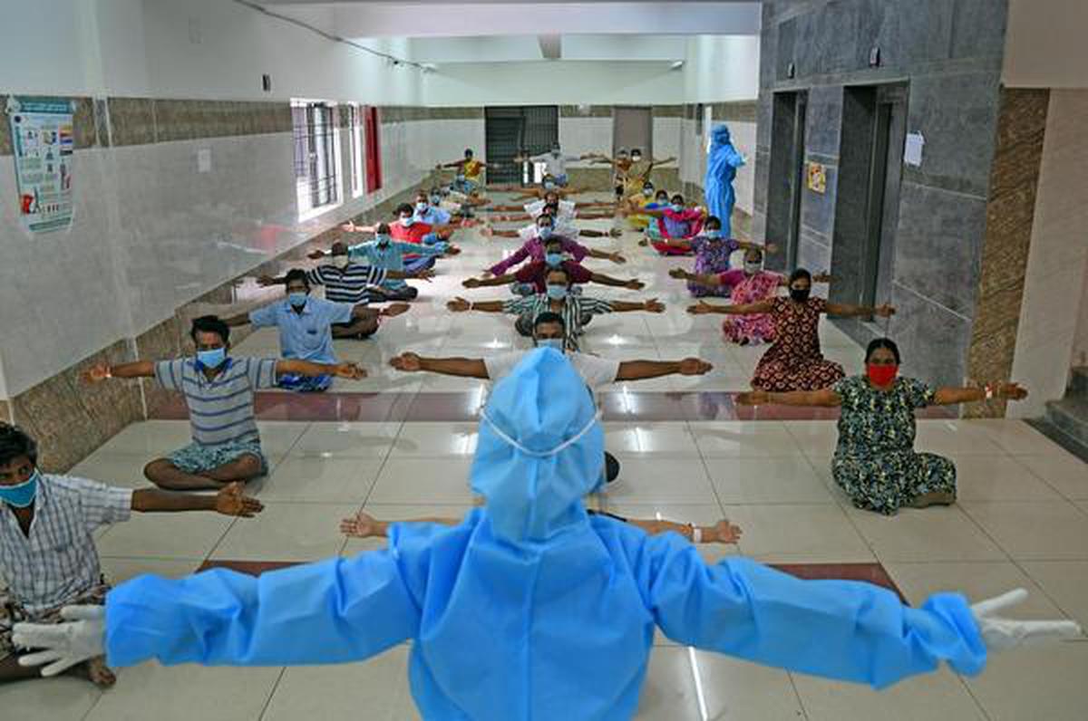 Doctors wearing a personal protective equipment (PPE) face mask and gloves conducted Yoga training to Coronavirus patients at Rajiv Gandhi Government General Hospital (RGGGH) in Chennai on August 14, 2020