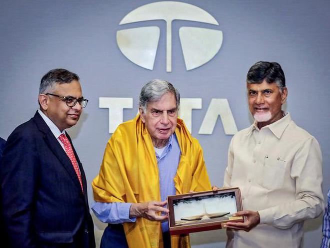 Inviting business: Chief Minister N. Chandrababu Naidu felicitates industrialist Ratan Tata as Tata Sons chairperson Natarajan Chandrasekaran looks on, in Mumbai .