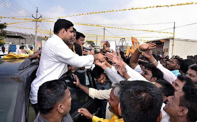 IT Minister N. Lokesh greeting people at Darimadugu, near Markapur in Prakasam district on Thursday.
