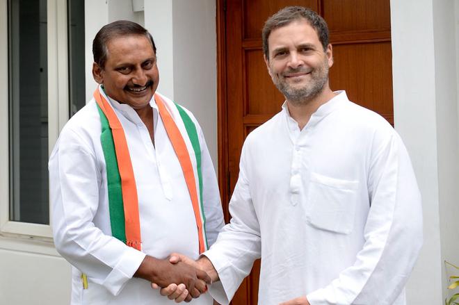 Former Andhra Pradesh Chief Minister N. Kiran Kumar Reddy with Congress president Rahul Gandhi after rejoining the party in New Delhi on July 13, 2018.