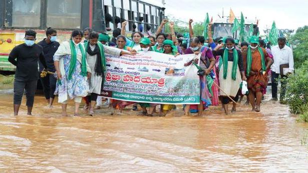 Amaravati farmers march braving intermittent rain
