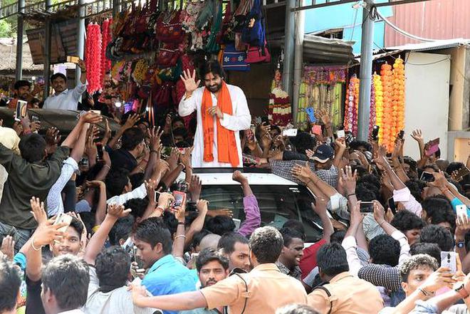 In campaign mode: Jana Sena Party president Pawan Kalyan greeting his supporters outside the temple in Srikalahasti on Tuesday.