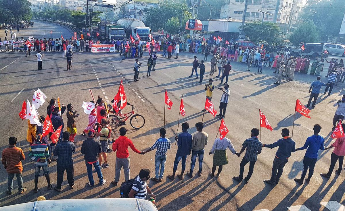 Cadres and leaders of CPI staging a 'rasta roko' near Maddilapalem bus stop as part of Bharat Bandh in Visakhapatnam on Tuesday.
