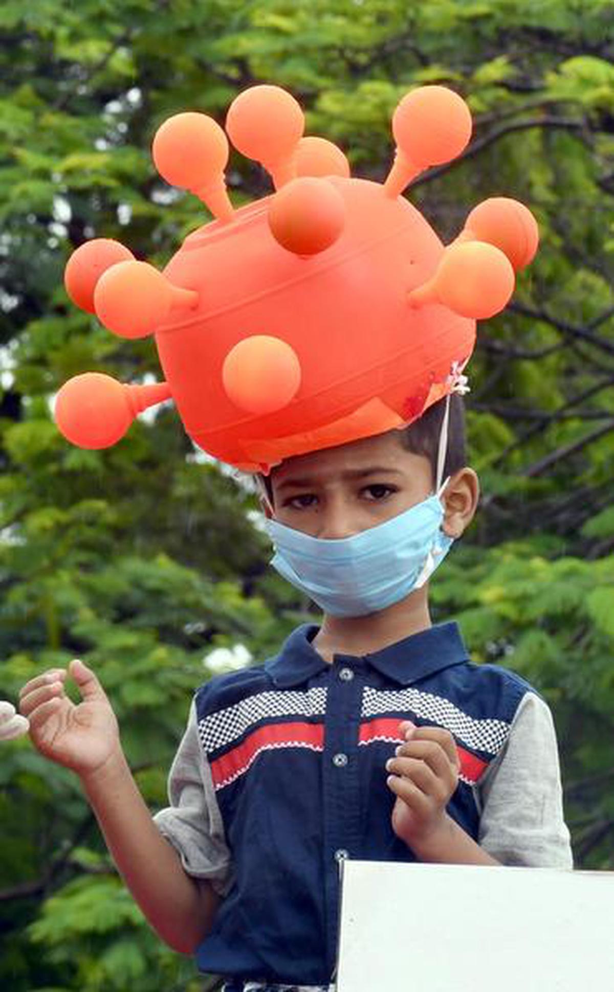 A child posing as a novel coronavirus was a part of the tableau spreading awareness about COVID-19 at the Independence Day celebrations at Police Parade Grounds in Kalaburagi August 15, 2020