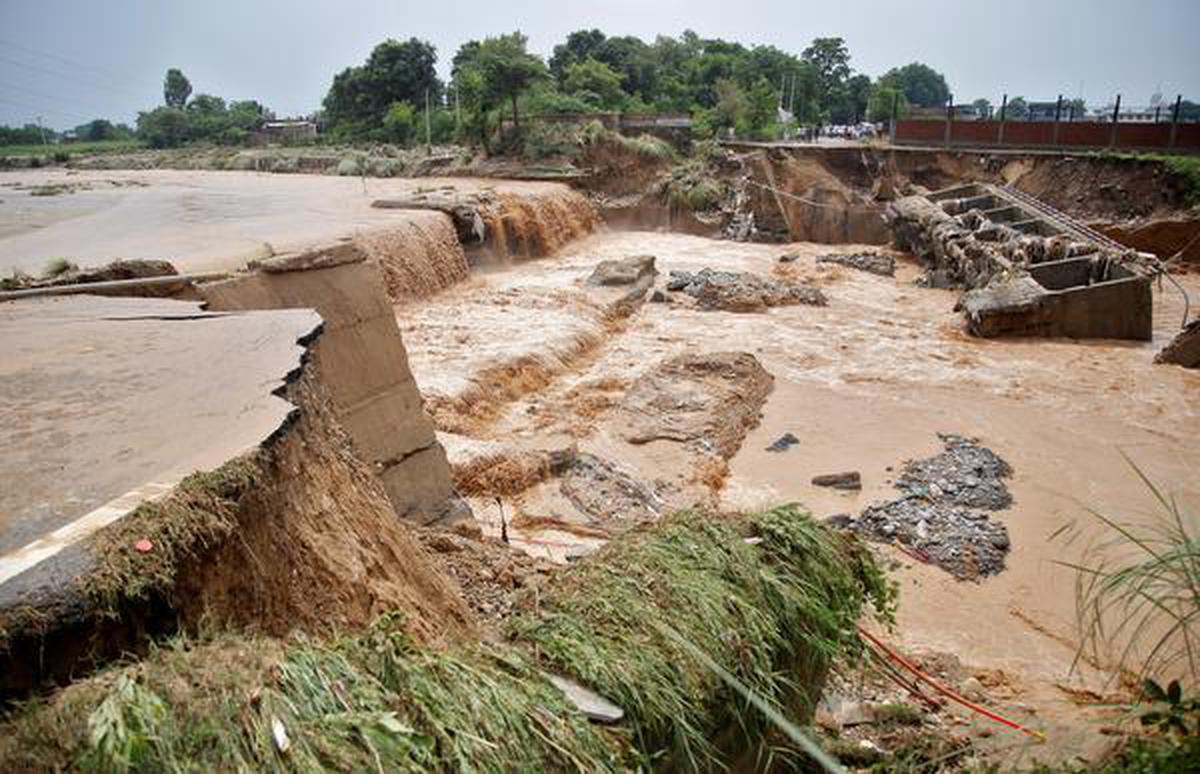 A view of a damaged bridge is seen after it was washed away by rain water following heavy rains in Jammu August 26, 2020.