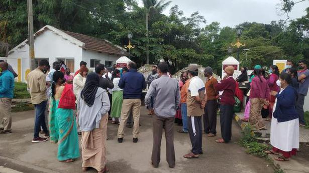 No vaccine: People gather outside home of Hassan Deputy Commissioner