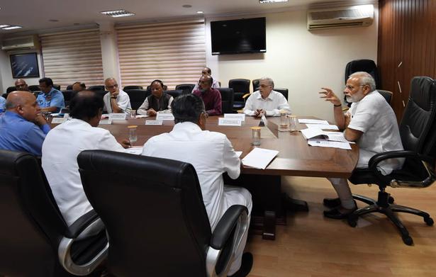 Narendra Modi chairs a review meeting with Kerala CM Pinarayi Vijayan and officials at Naval Hospital Sanjivani on the Southern Naval Command campus in Kochi, August 18, 2018