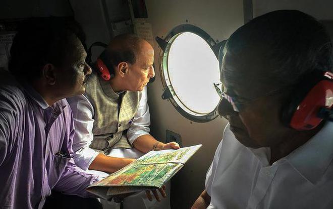 Taking stock: Union Home Minister Rajnath Singh and Chief Minister Pinarayi Vijayan during an aerial survey of the flood-affected areas in Kerala on Sunday.