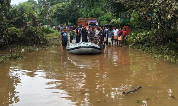 Navy personnel carry out rescue operations near Chalakudy, Kerala on Saturday.