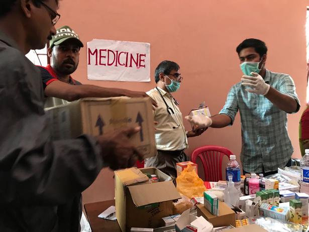 Medicines arrive at one of the college relief camps where more than 8,000 people are currently lodged.