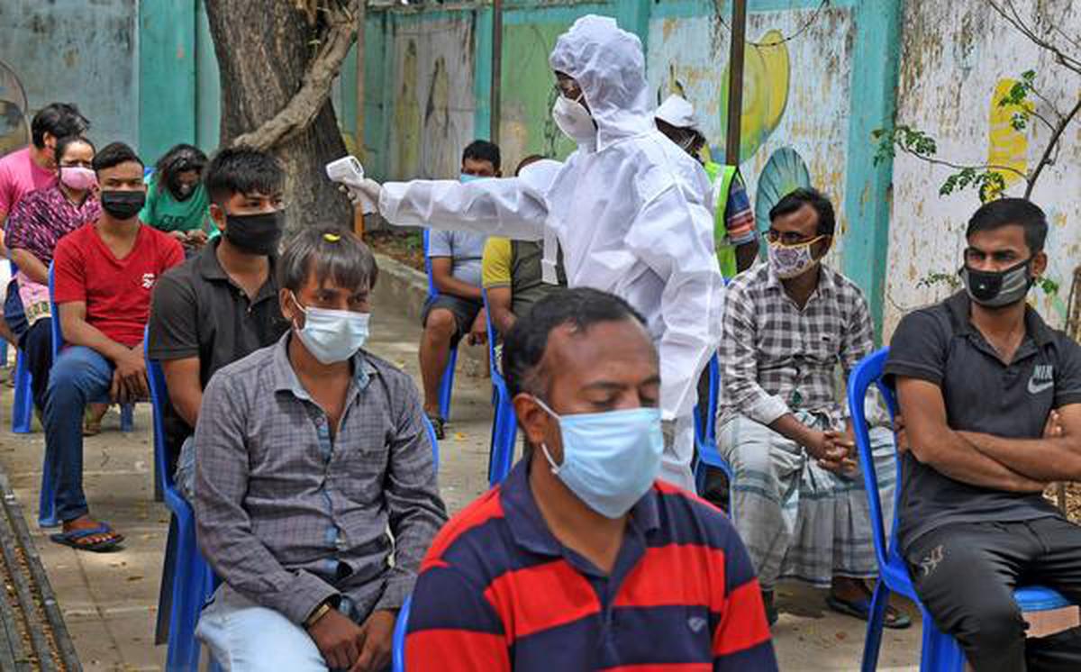 Greater Chennai Corporation health worker wearing personal protective equipment (PPE) checking people at a fever camp at Collector colony, Amijikarai in Chennai on August 16, 2020
