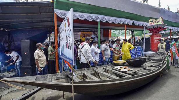 TMC protests over fuel price hike, supporters served food cooked on firewood oven