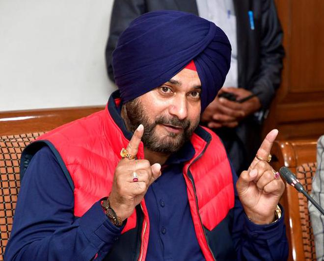 Image result for cricketer turned politician Navjot Singh Sidhu said Friday it was Congress president Rahul Gandhi who sent him there for attending the foundation laying ceremony of the Kartarpur Sahib corridor