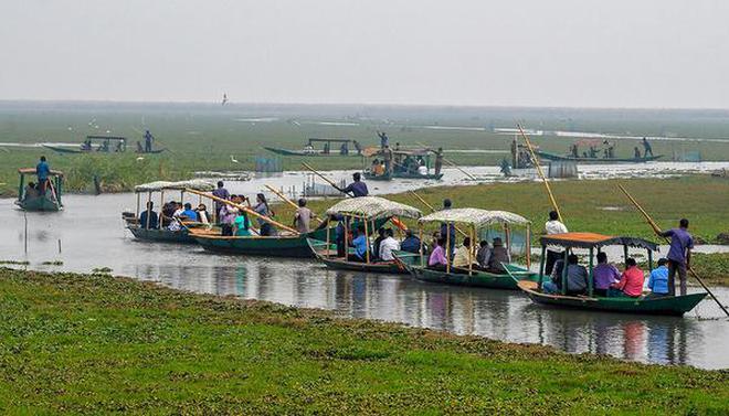 Birdwatchers in boats at the second National Chilika Bird Festival at Mangalajodi in Odisha on Sunday.