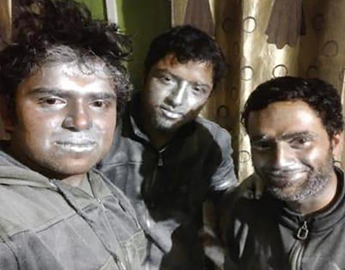 Umar Farooq, Sameer Dar and the bomber Adil Ahmad Dar, with explosive powder smeared on their faces. The photo was taken while they were making the IED, the NIA said.