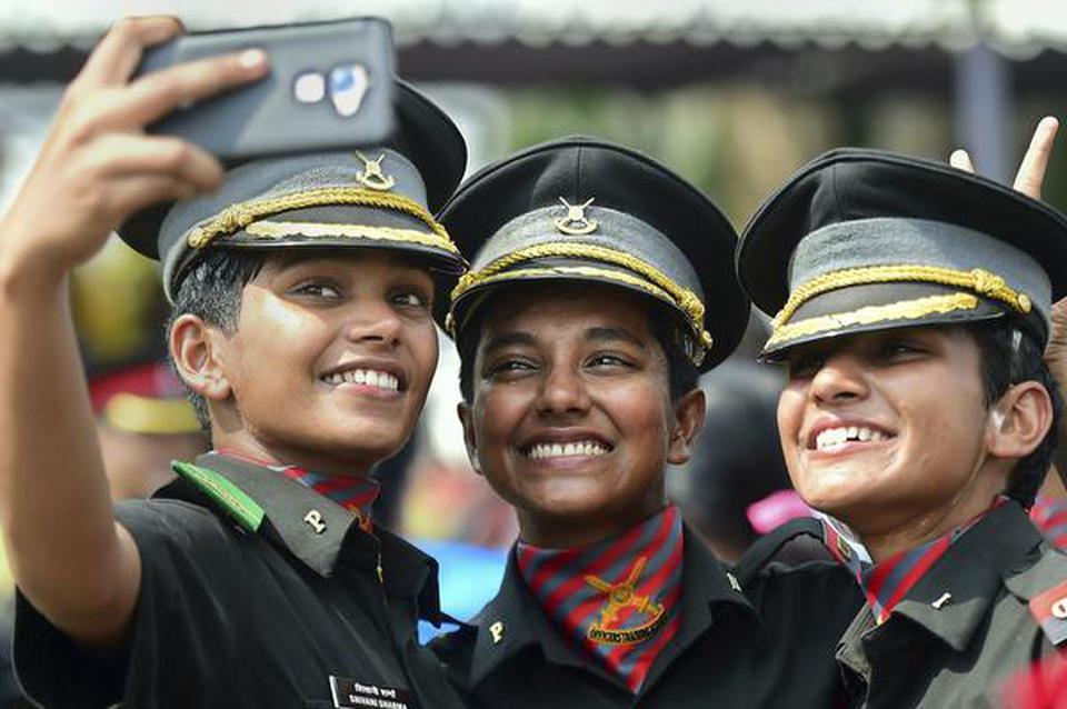 Lady cadets take selfie as they celebrate after the passing out parade at the Officers Training Academy in Chennai on March 9, 2019.