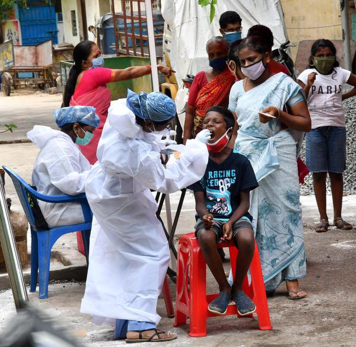 Chennai Corporation health worker takes a swab sample of a person for COVID-19 test in Kodambakkam in Chennai on July 24, 2020