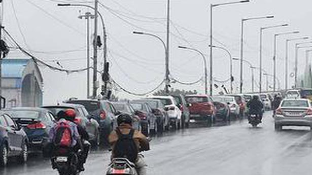 Marooned residents leave vehicles on flyover fearing heavy rain