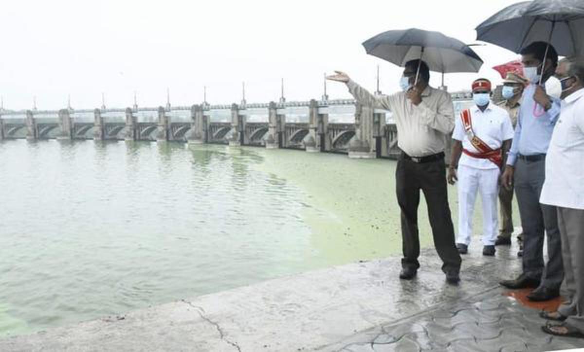 District Collector S. Karmegam (first left) inspecting Stanley Reservoir in Mettur Dam as the water level is nearing 118 feet against the Full Reservoir Level of 120 feet