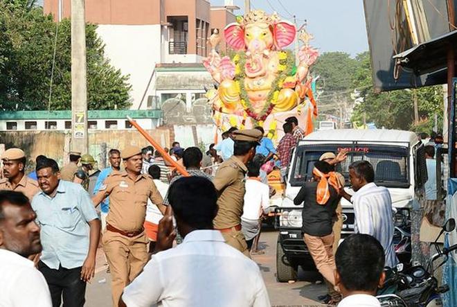 Police personnel at the procession held at Shencottai in Tirunelveli on Friday.