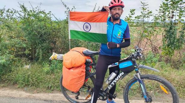 Cyclist pedals on with a conservation message
