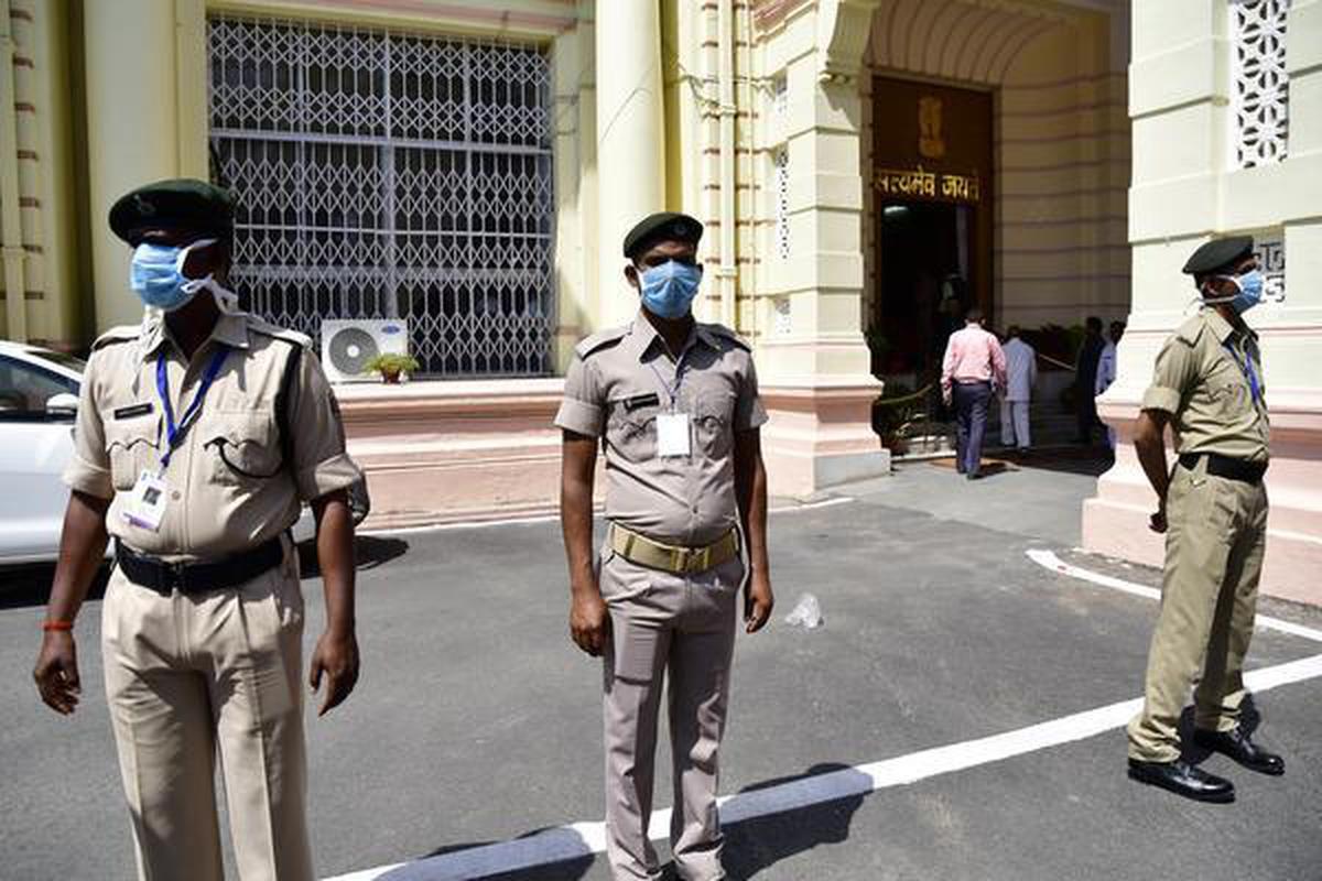 Security personnel wearing masks guarding the Bihar Assembly in Patna. File photo