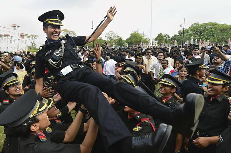 Cadets lift a colleague as they celebrate after the passing out parade at the Officers Training Academy in Chennai on March 9, 2019.