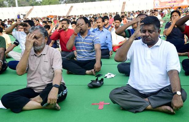 Union Law Minister Ravi Shankar Prasad and Bihar Deputy Chief Minister Sushil Kumar Modi participating in a mass yoga session in Patna.