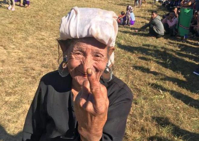 An elderly Bru refugee reacts after casting her vote at Kahnmun playground in Mizoram. File