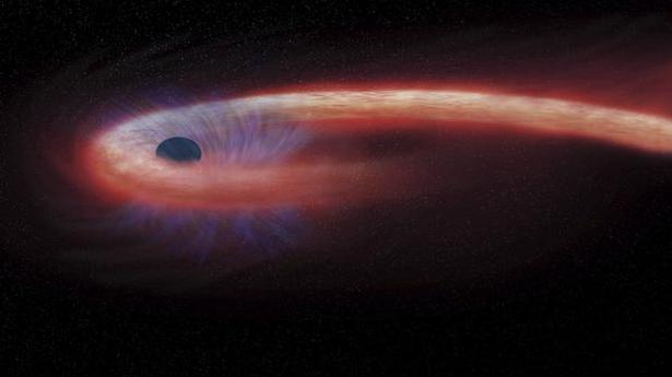 Astronomers sight wandering huge black hole, but at a safe distance