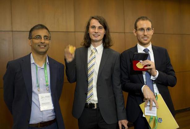 Akshay Venkatesh (left), Italy's Alessio Figalli (right) and Germany's Peter Scholze, pose for a photo during the 2018 International Congress of Mathematicians in Rio de Janeiro, Brazil on August 1, 2018.