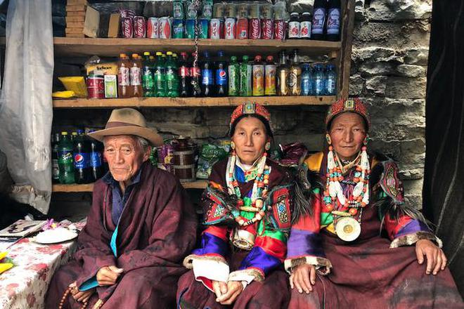 Village elders mind a shop stocked with goods from China.