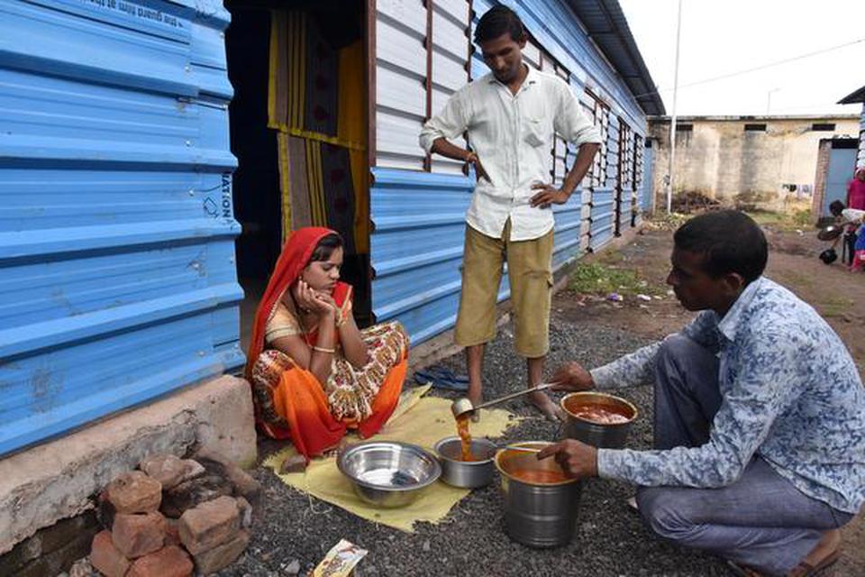 A family in a temporary relief shelter in Nisarpur, where they are provided food thrice a day.
