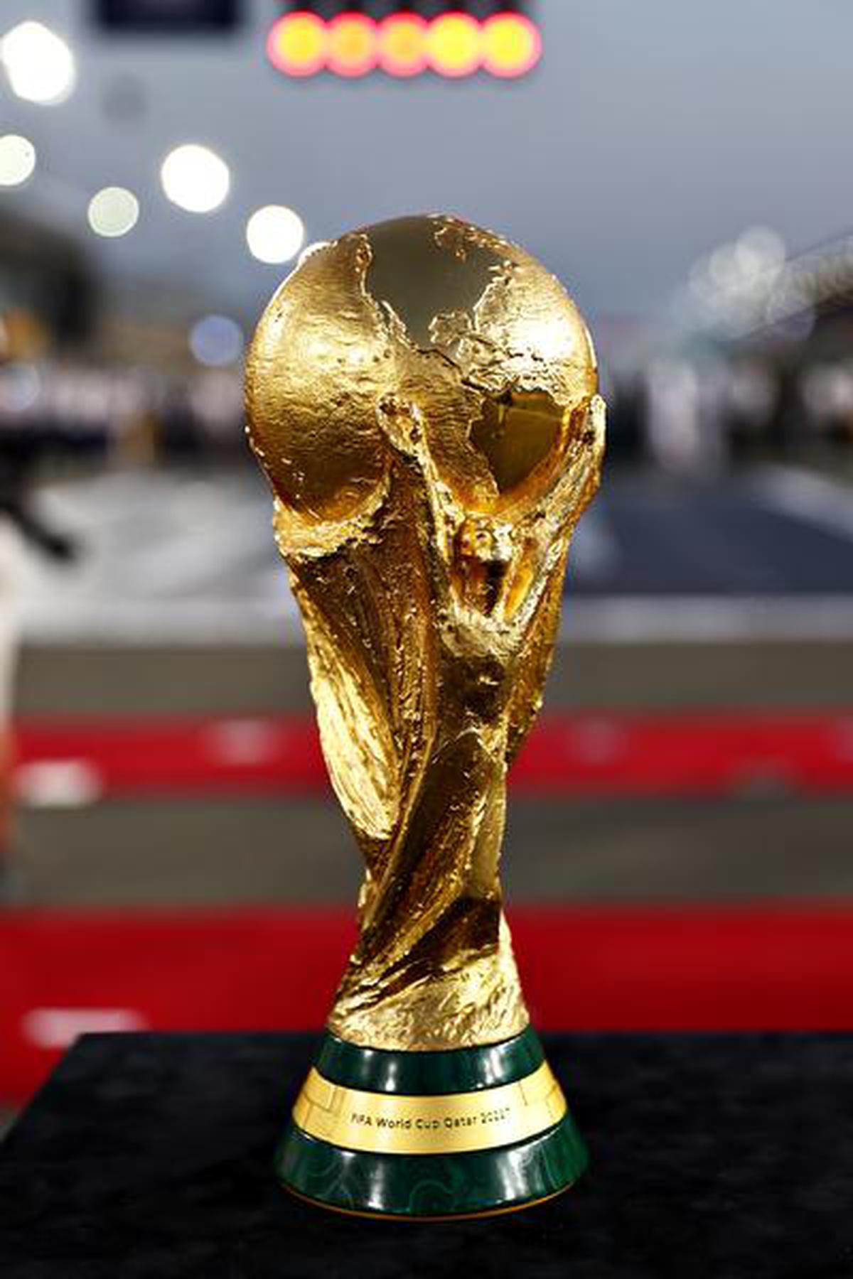 The FIFA World Cup trophy is pictured on the grid before the F1 Grand Prix of Qatar at Losail International Circuit on November 21, 2021 in Doha, Qatar.