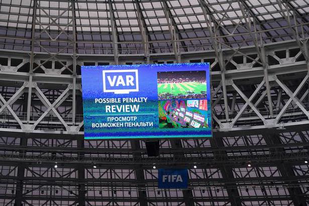 The giant screen announces a VAR review during a FIFA World Cup 2018 match in Moscow.