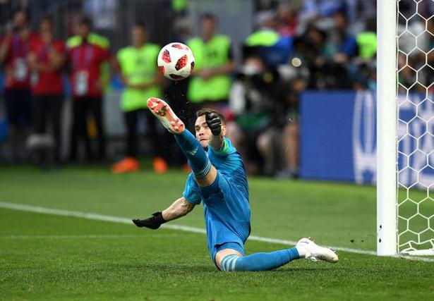Russia’s Igor Akinfeev saves a penalthy during the match against Spain.