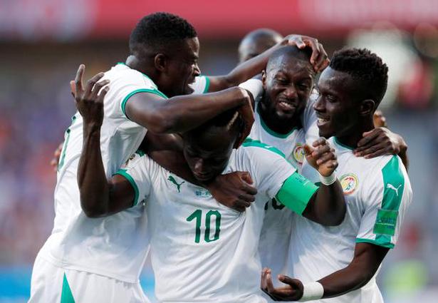 Senegal’s players celebrate during the match against Japan.
