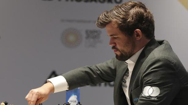 World Chess Championship | Carlsen’s tenacity leads to 136-move victory