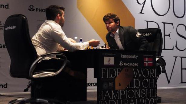 World Chess Championship: Magnus Carlsen wins fifth title with three games to spare