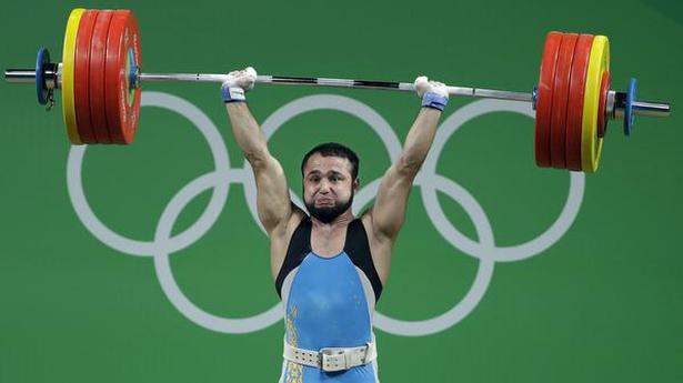 Olympic champion charged in weightlifting doping case