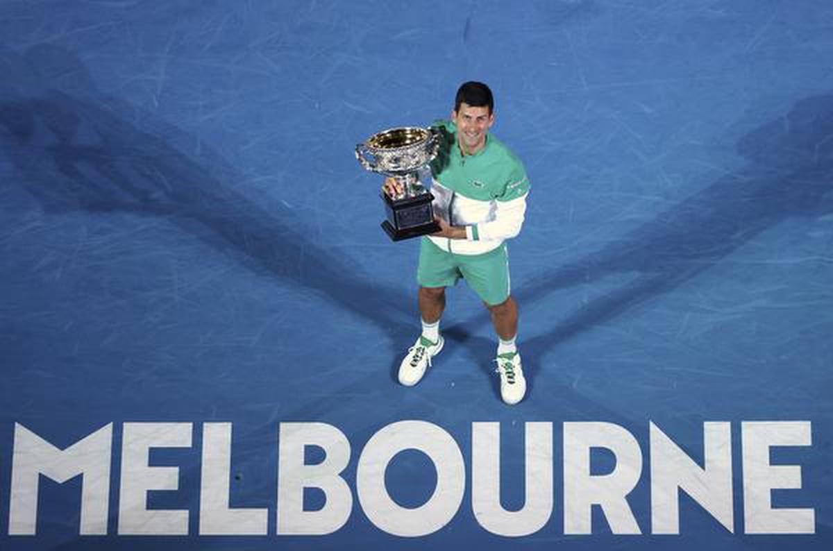 Serbian player Novak Djokovic wins the Norman Brooks Challenge Cup after defeating Russian Daniil Medvedev in the men's singles final at the Australian Open in Melbourne, Australia on February 21, 2021.